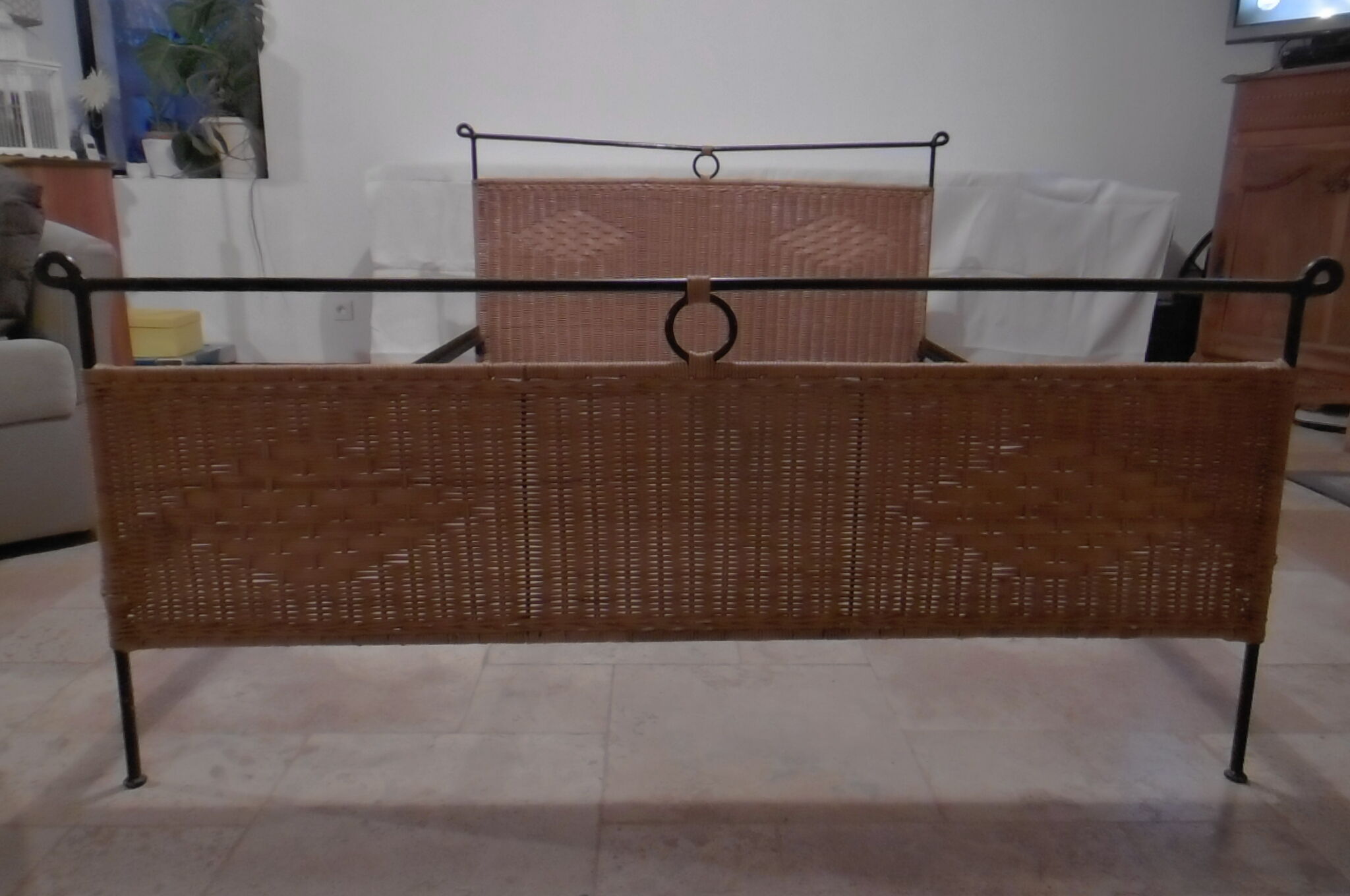 Black metal and rattan bed frame