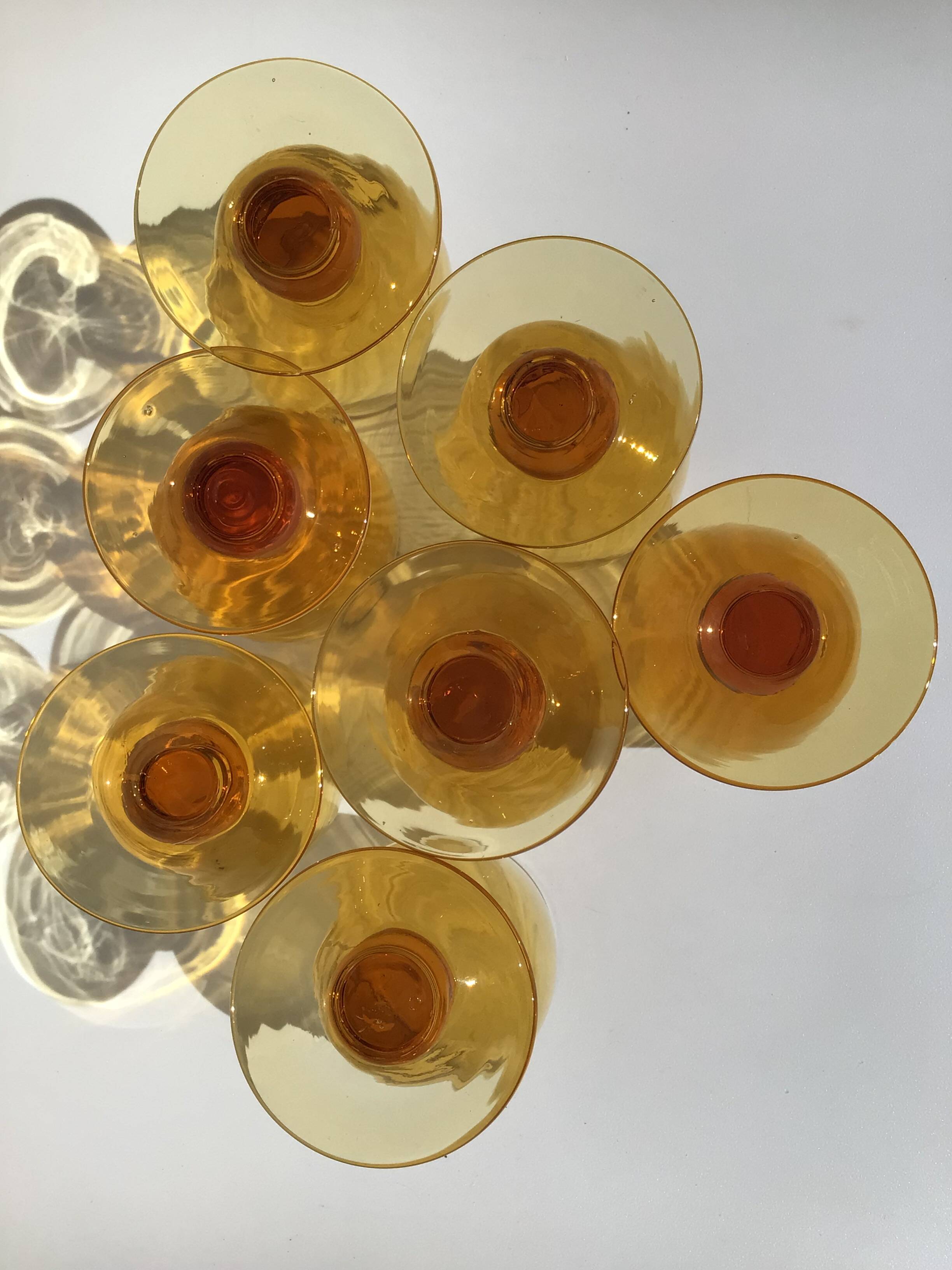 7 Amber stemmed glasses