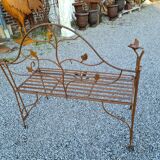 Wrought iron garden bench with birds