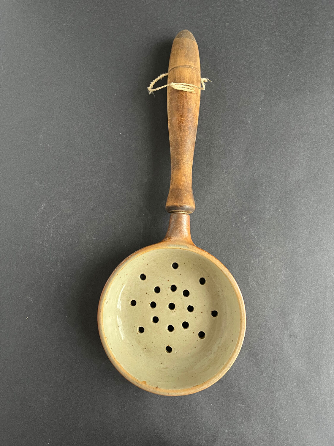 Ladle and sandstone strainer