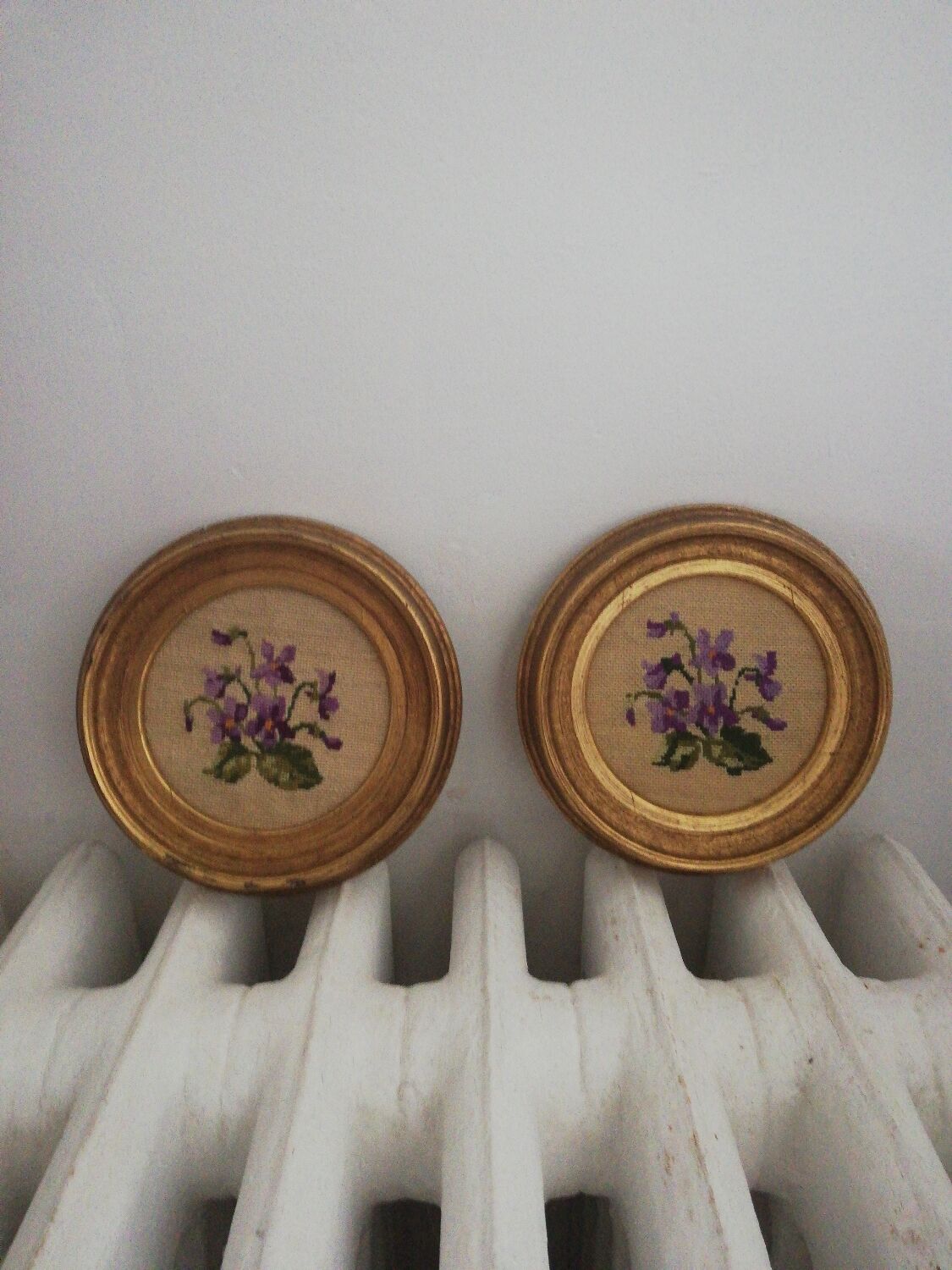 Pair of miniature gold round frames