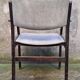 Wooden armchair and faux leather.