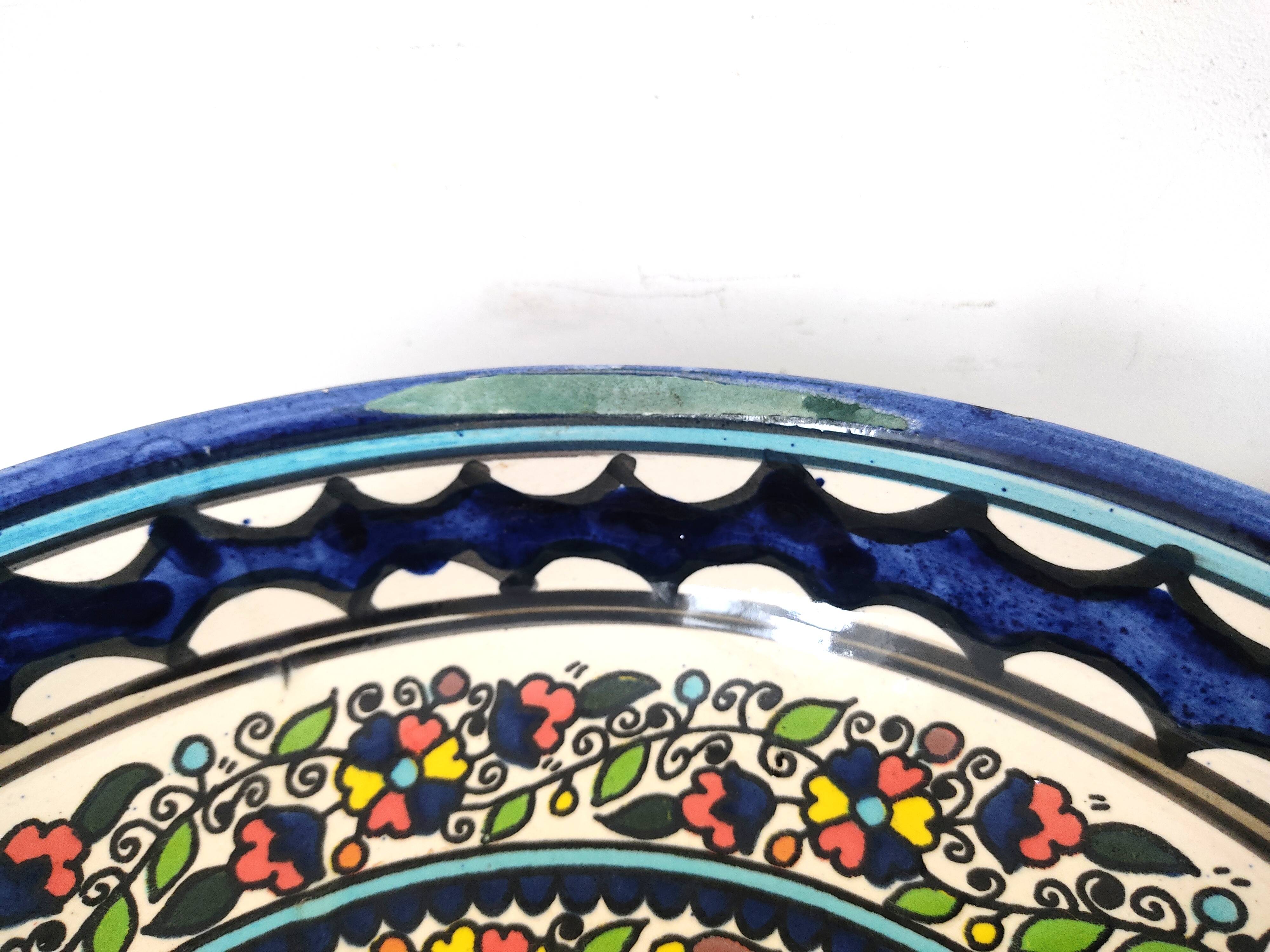 Large decorative dish with colorful peacock