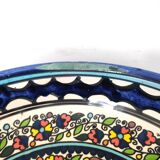 Large decorative dish with colorful peacock