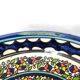 Large decorative dish with colorful peacock
