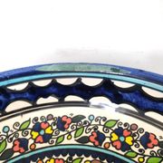 Large decorative dish with colorful peacock