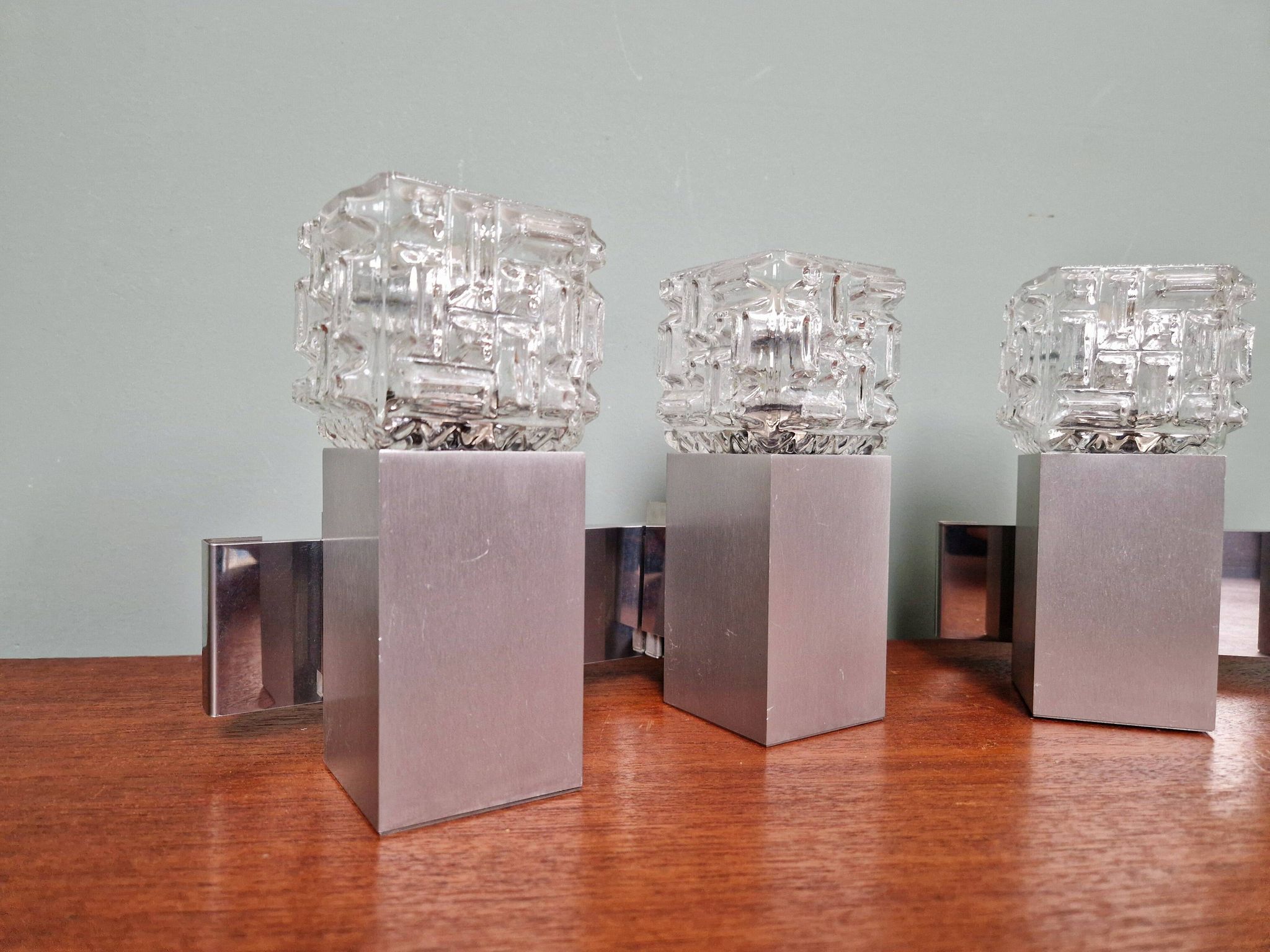 Pair of brushed aluminum and crystal wall lights, 1970s