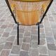 Folding chair in red scoubidou and black metal structure