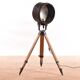Old industrial spot on wooden tripod floor lamp