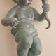 Pairs of wall lights, either two distinct cherubs.