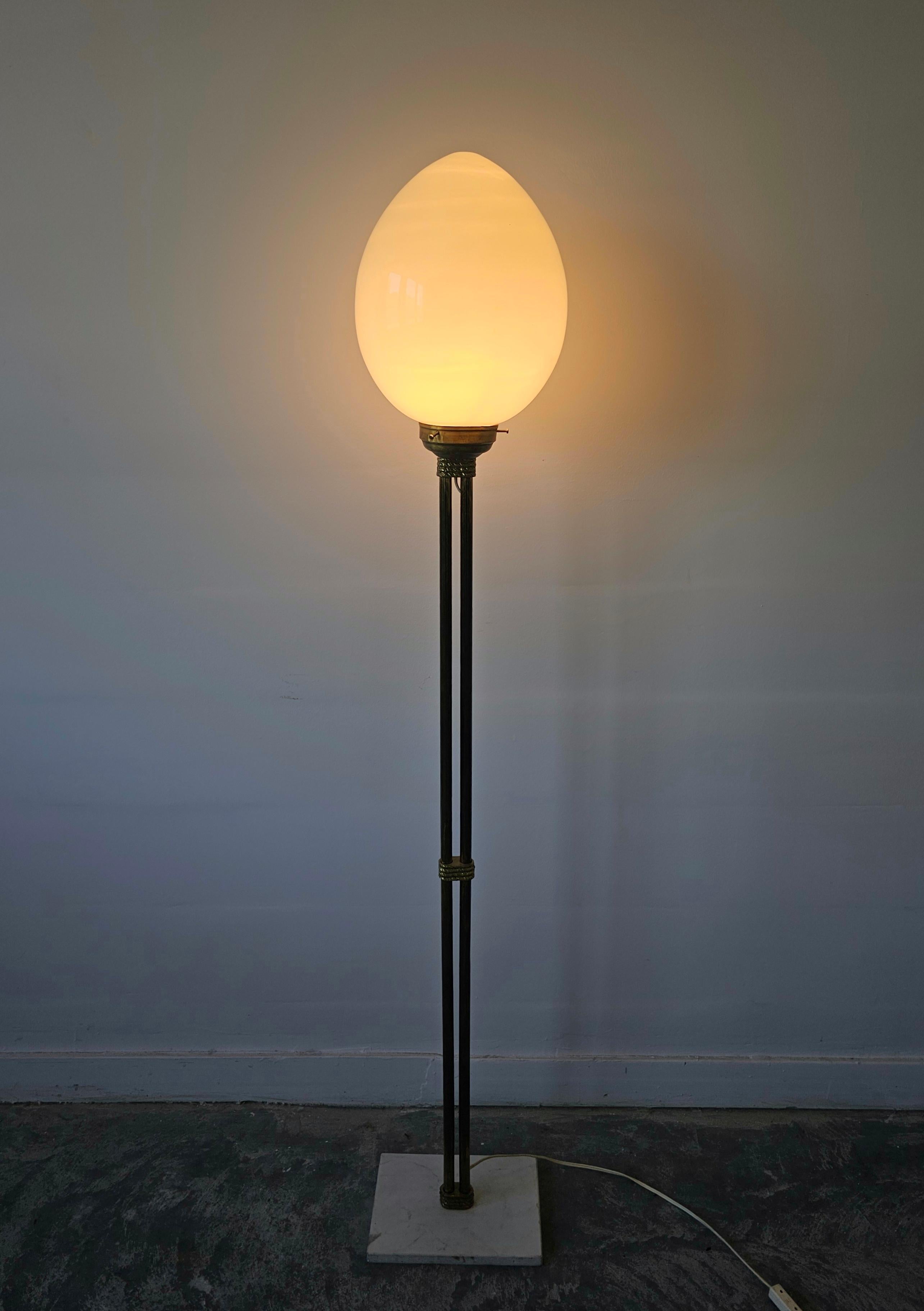 Mid-Century floor lamp with egg-shaped opal glass shade, brass base, marble base.
