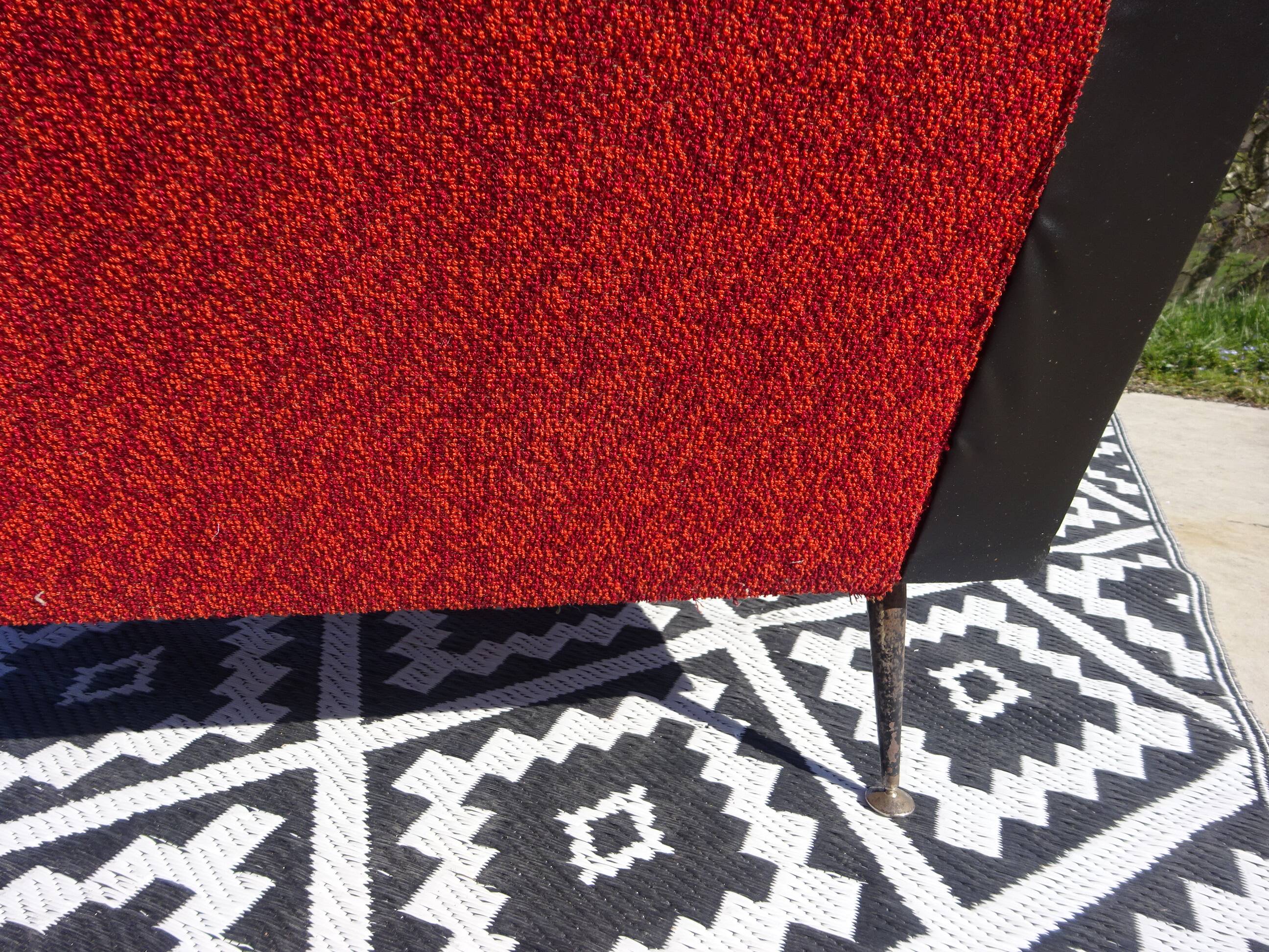Vintage armchairs in red and black faux leather, the pair.