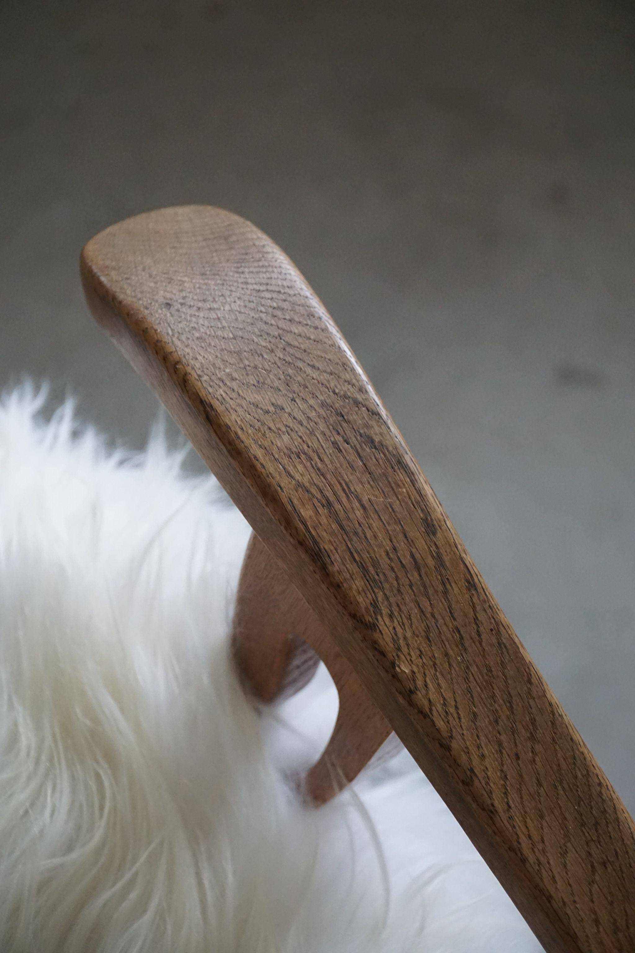 Henning Kjærnulf, armchair reupholstered in long-haired Icelandic sheepskin, 1950