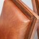 Pair of Art Deco armchairs in brown leather and teak, Netherlands, 1970s.