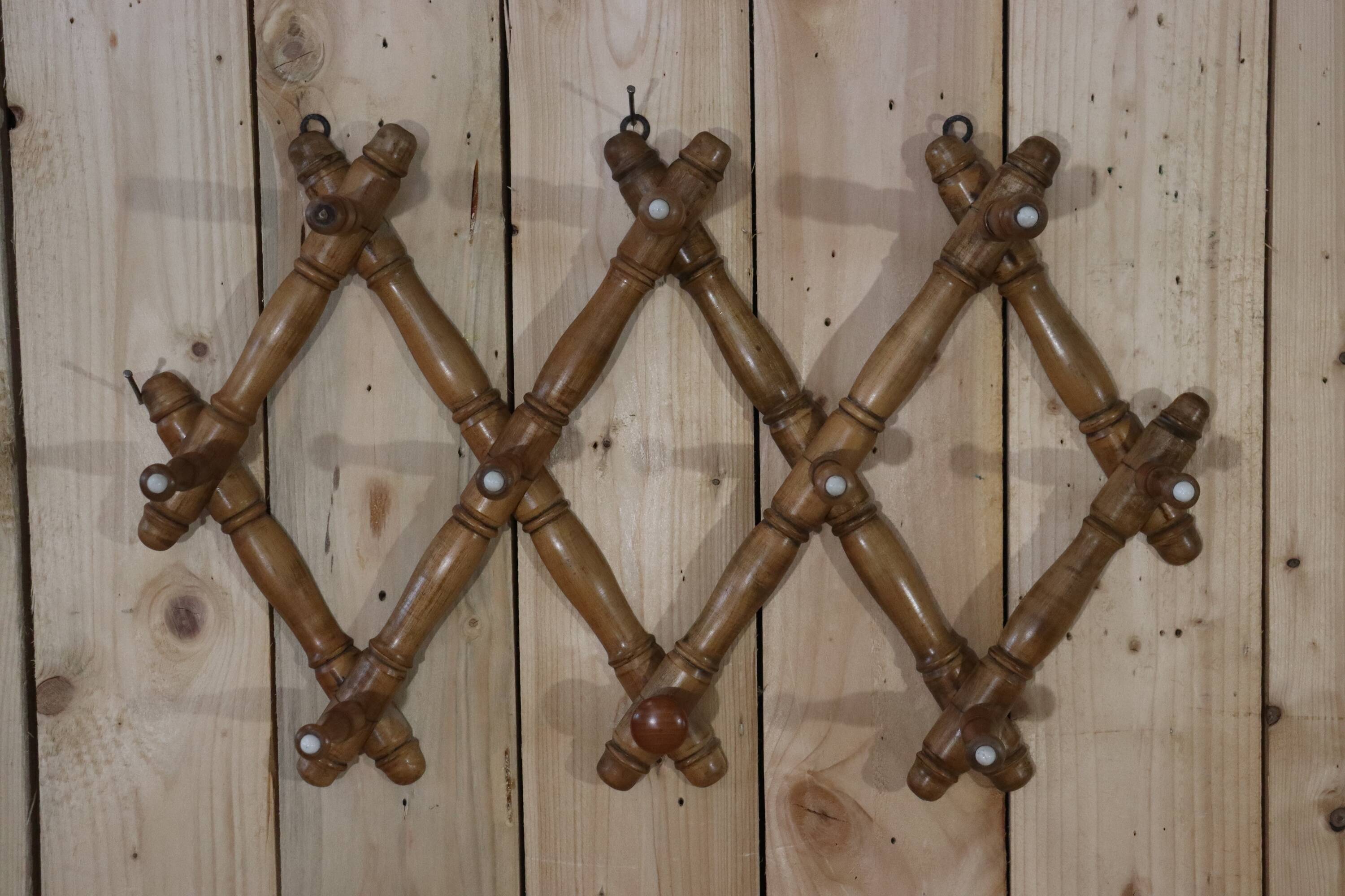 Old turned wooden wall coat rack