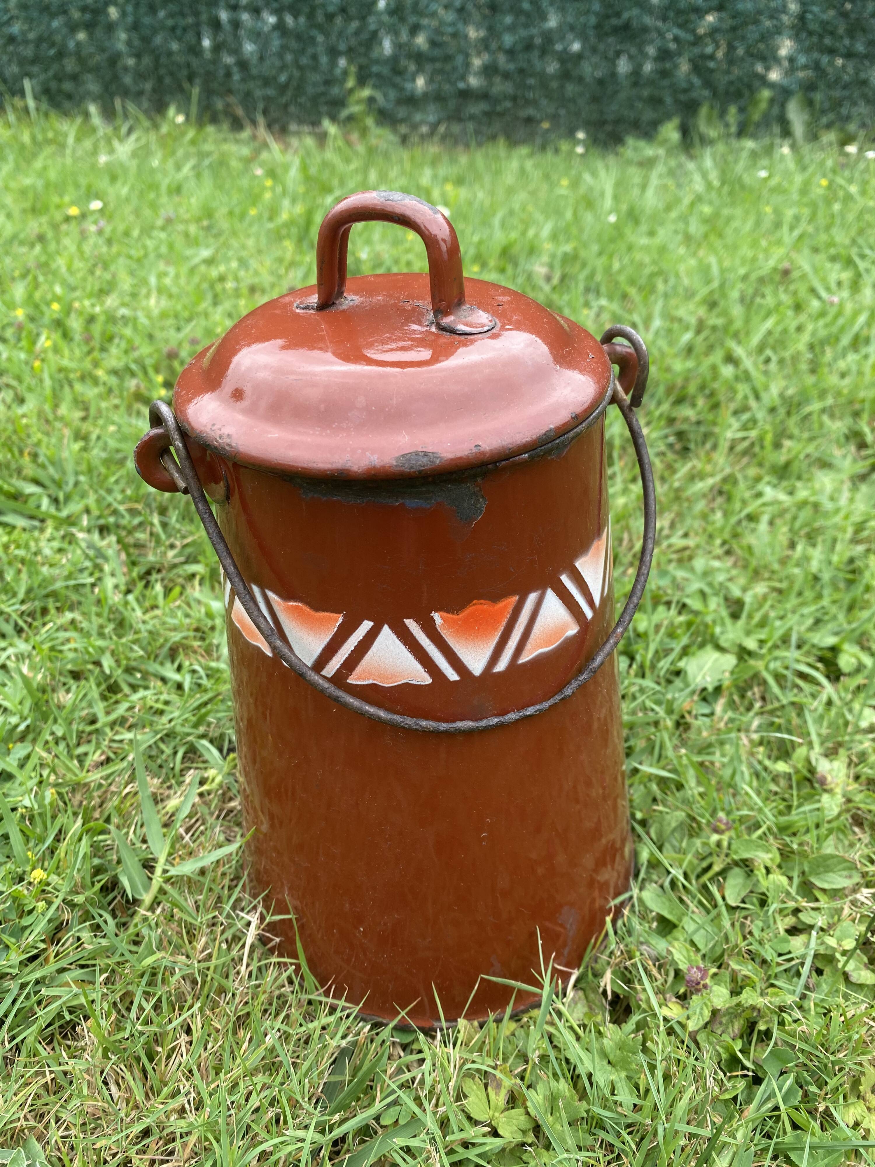 Old milk pot in enamelled sheet metal