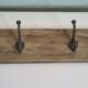 wooden school coat rack and iron hooks