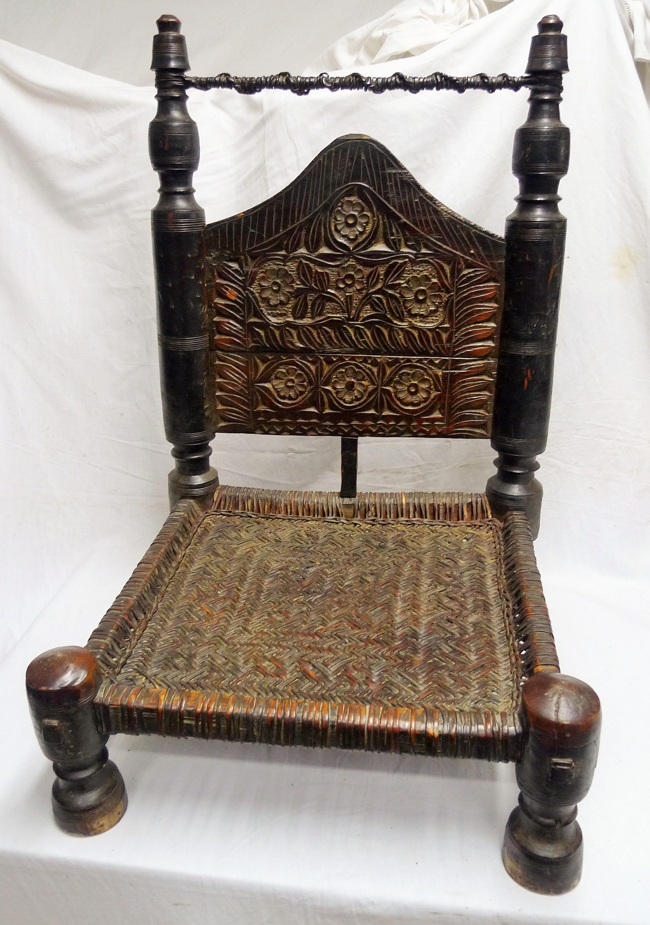 Traditional low chair in wood and leather