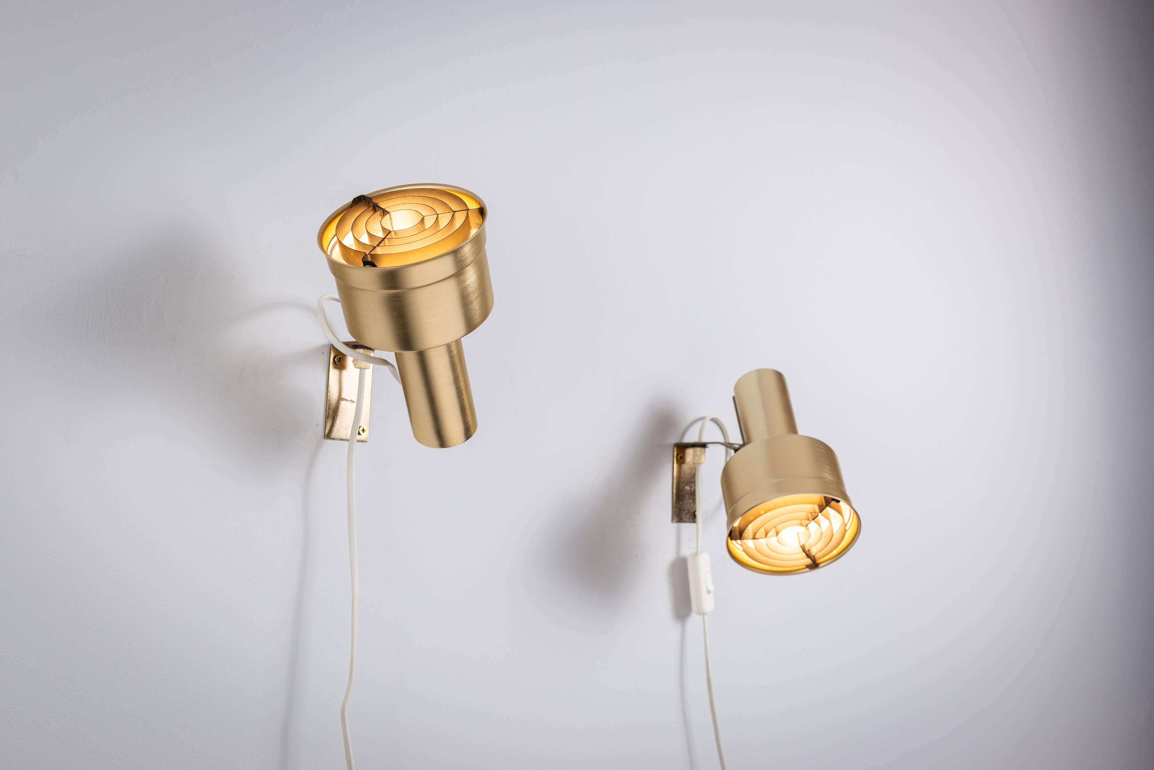 Pair of adjustable wall lamps designed by Per Sundstedt for Kosta Lampan