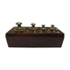 Brass weight series on wooden support
