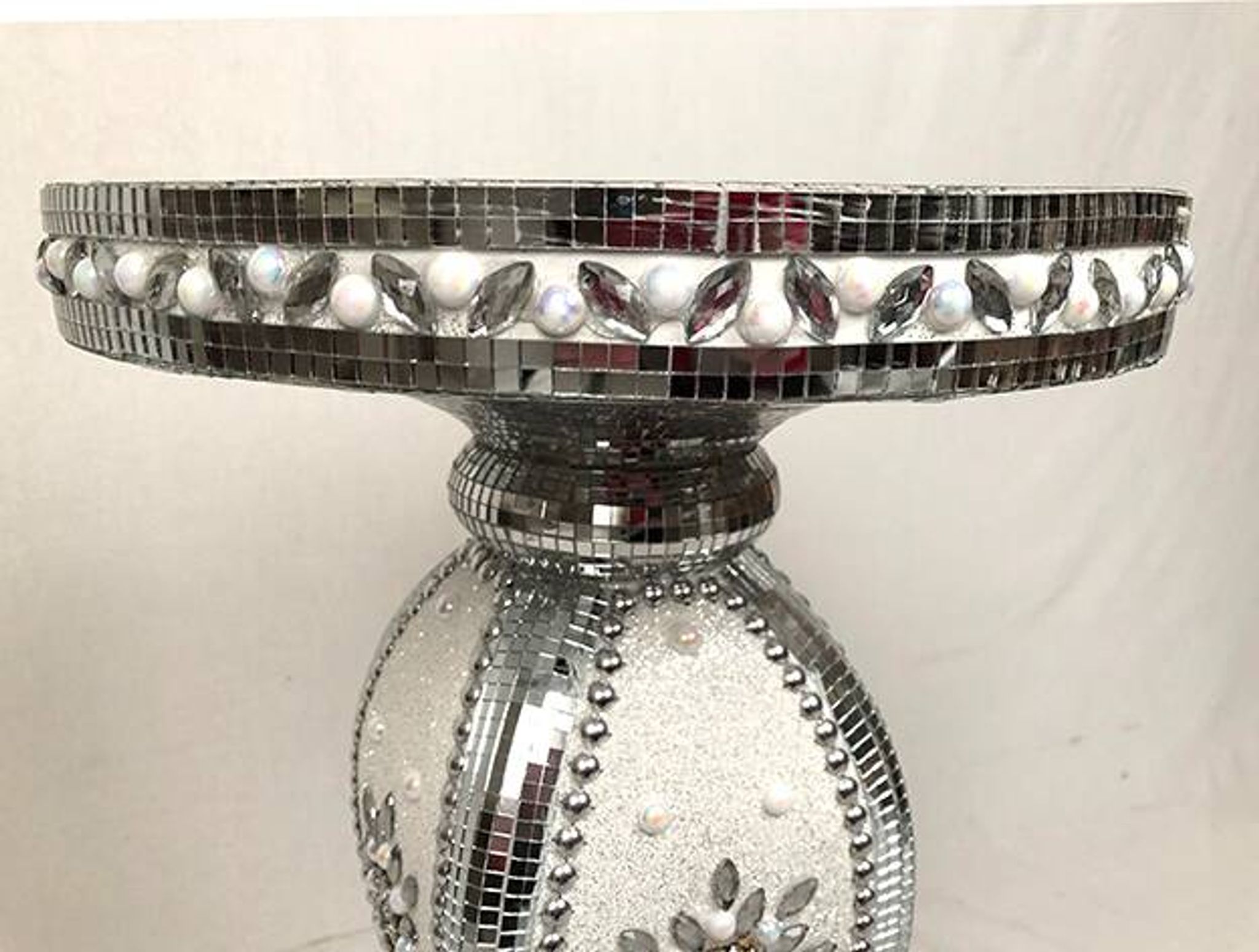 Small wooden pedestal table entirely covered with mirror mosaic
