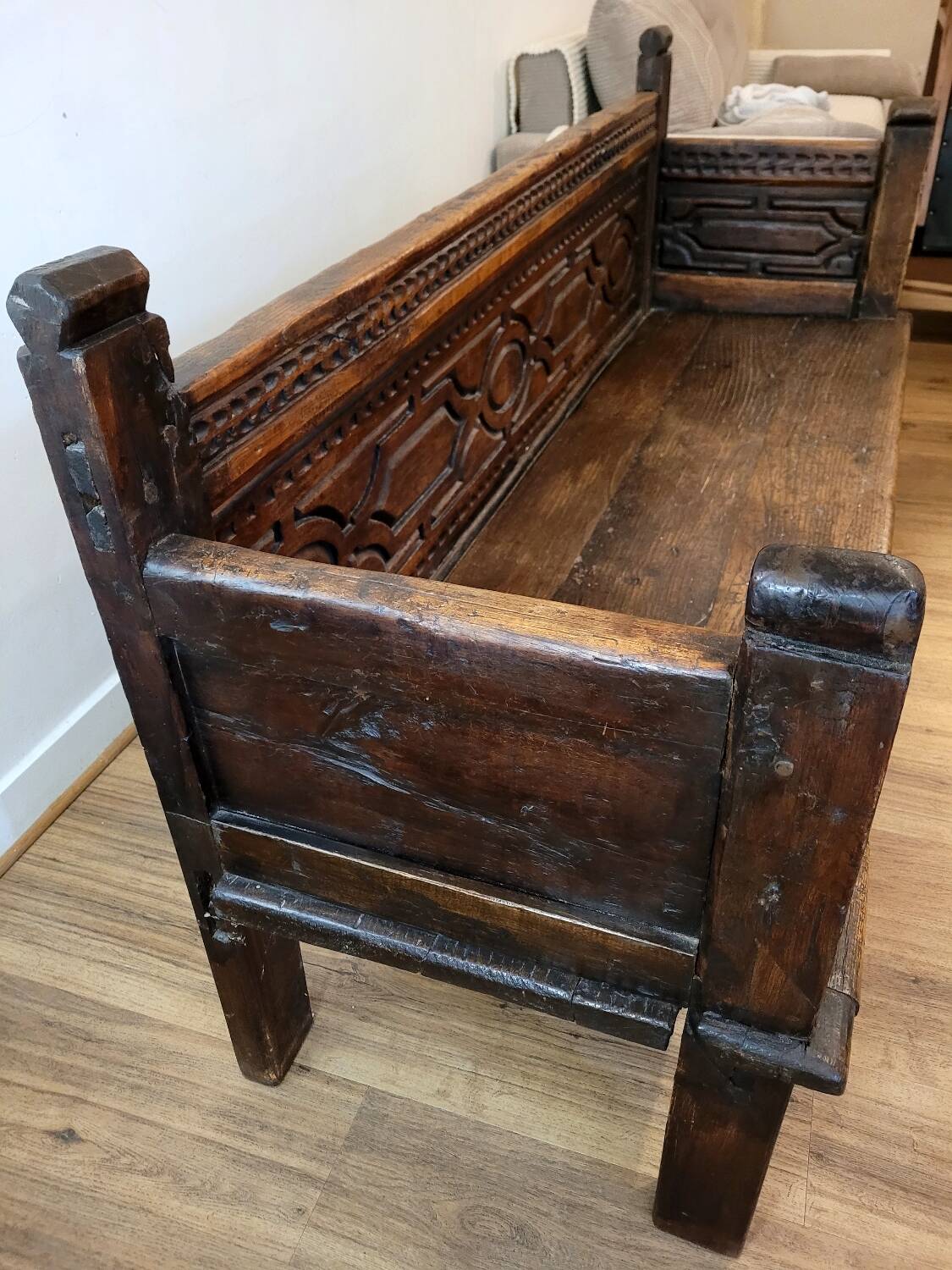 Antique carved solid wood bench from the early 20th century