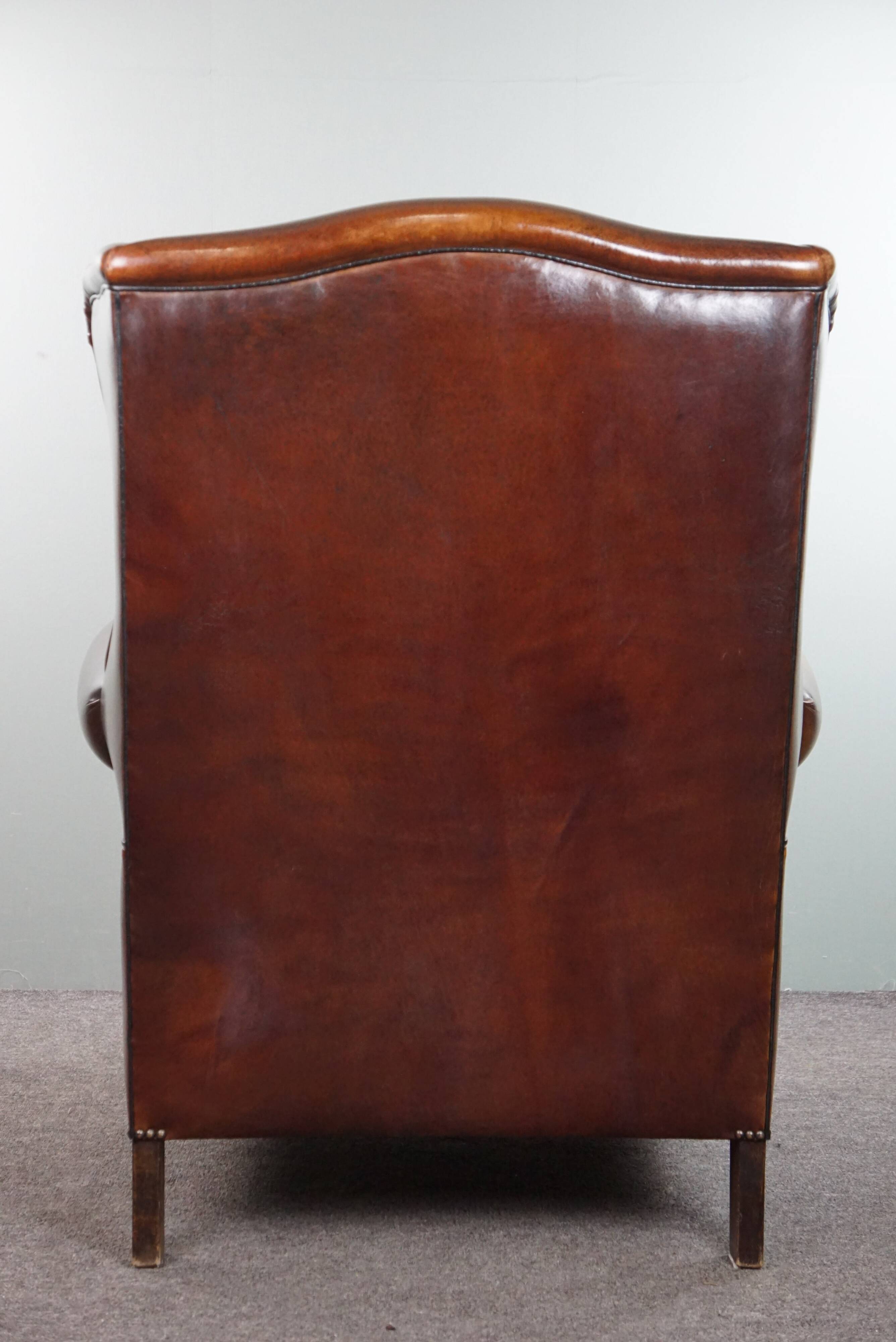Luxurious large sheep leather wingback armchair with beautiful colors and amazing patina
