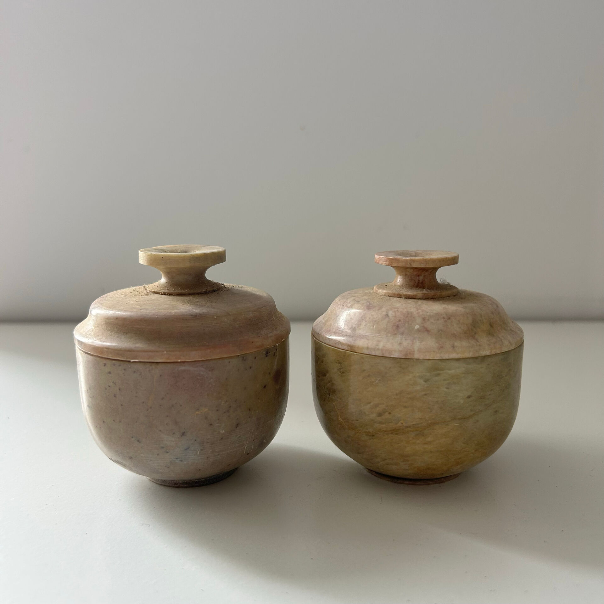 2 small stone urns