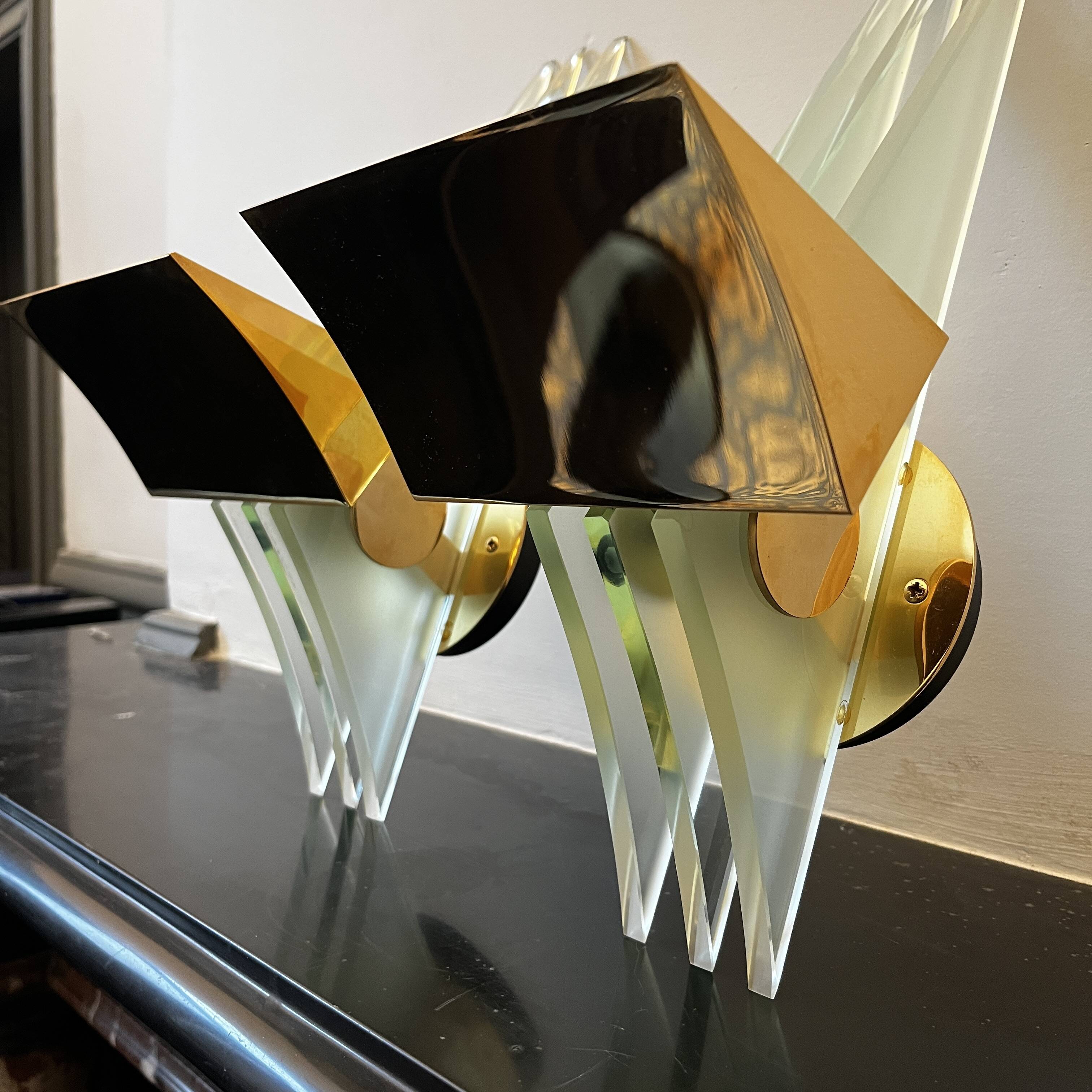 Pair of Hollywood Regency wall lights, bases & reflectors in gilded brass