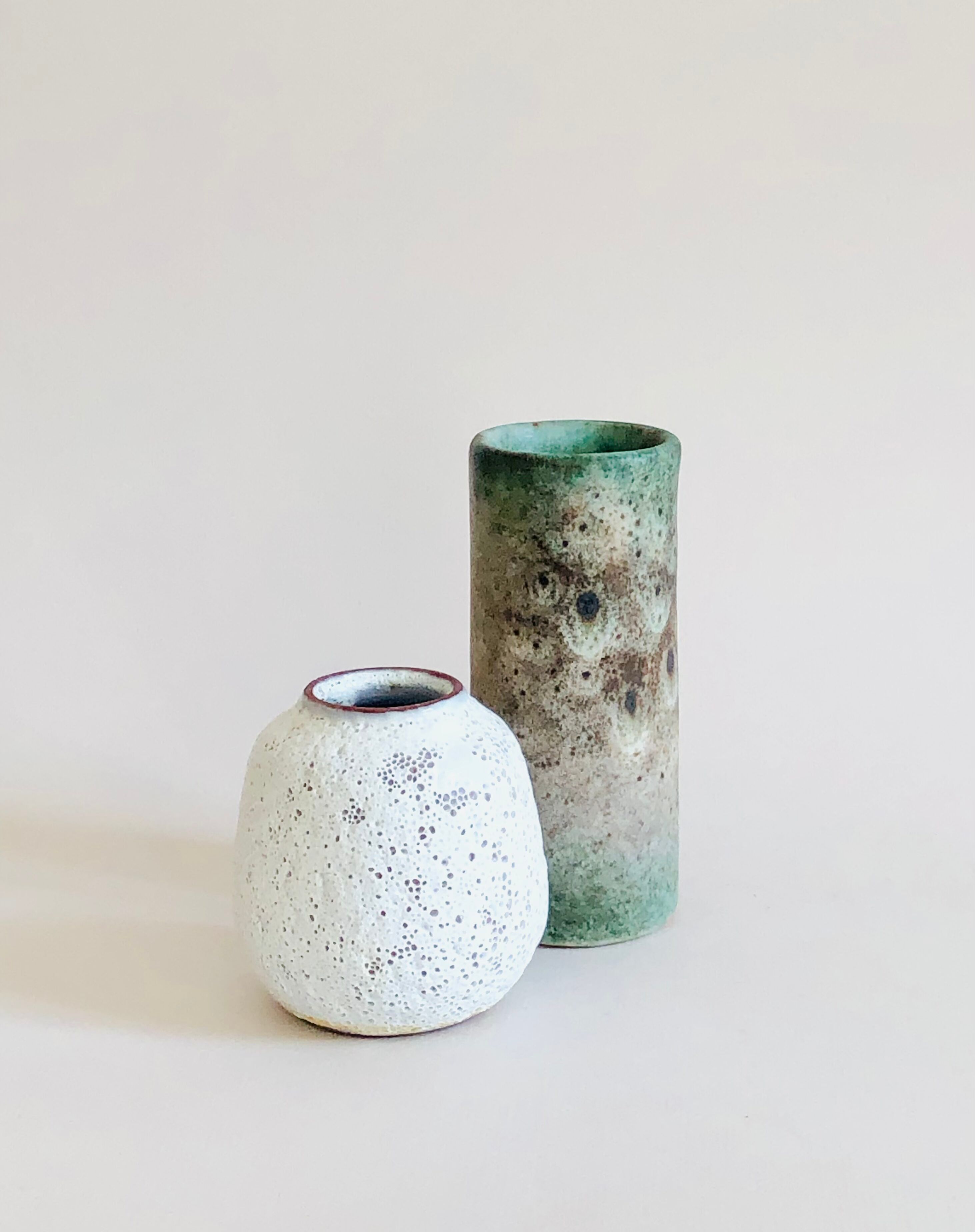 Duo of small sandstone vases