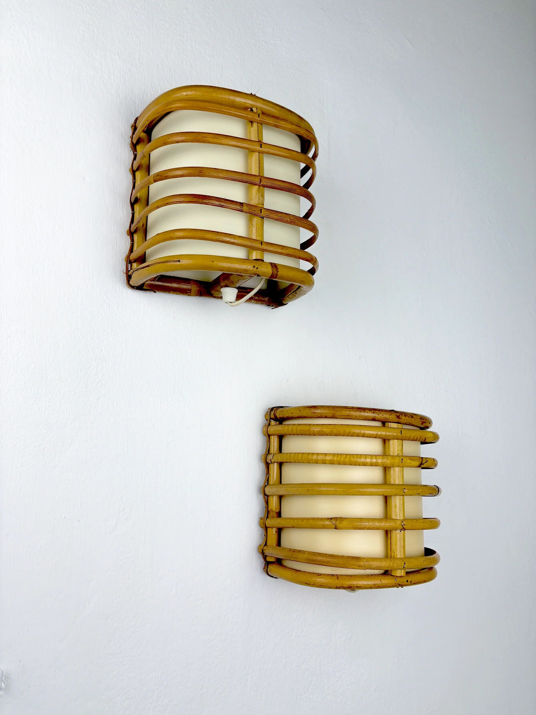 Pair of mid-century rattan wall sconces, 1960s, Italy