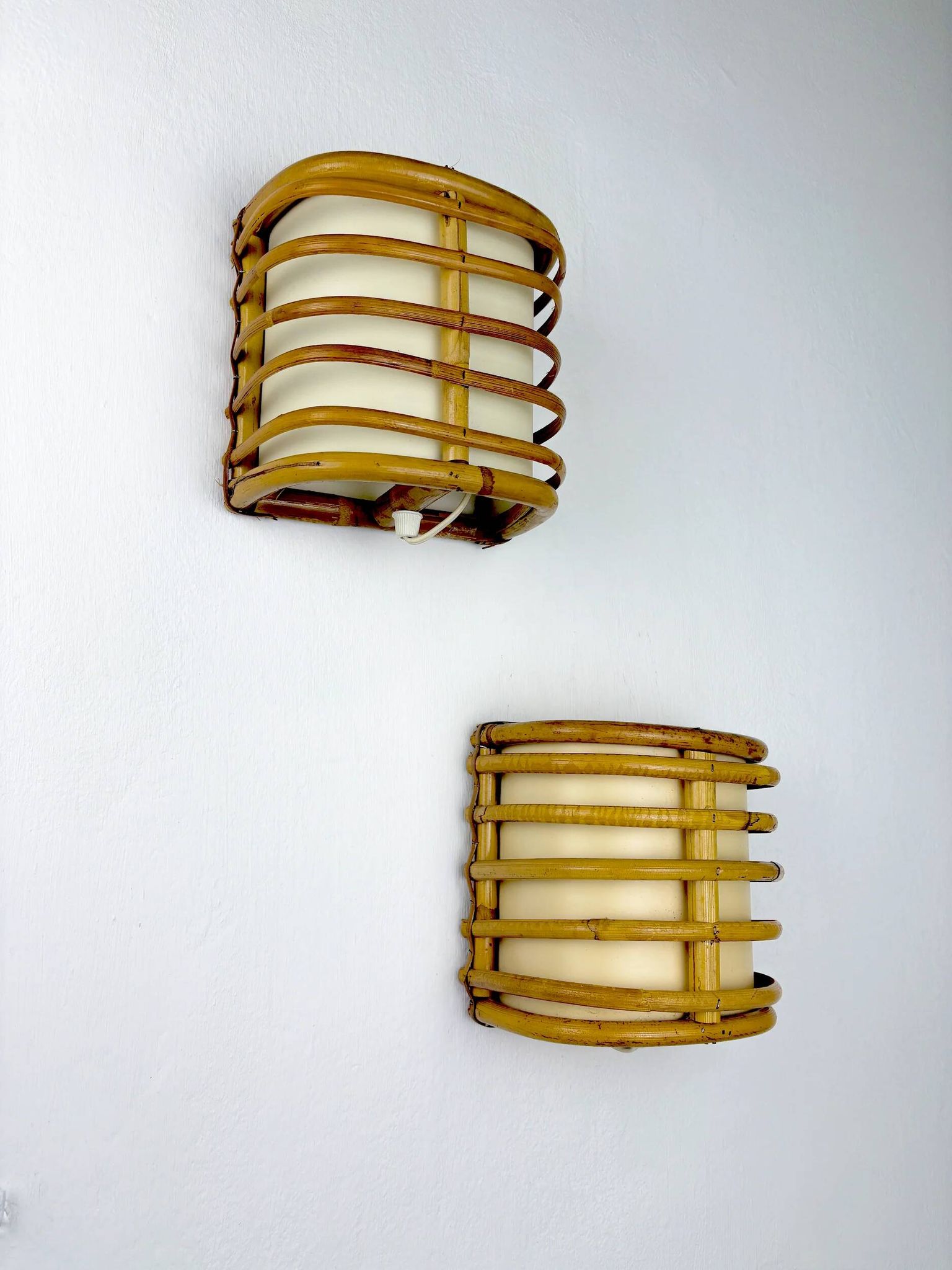 Pair of mid-century rattan wall sconces, 1960s, Italy