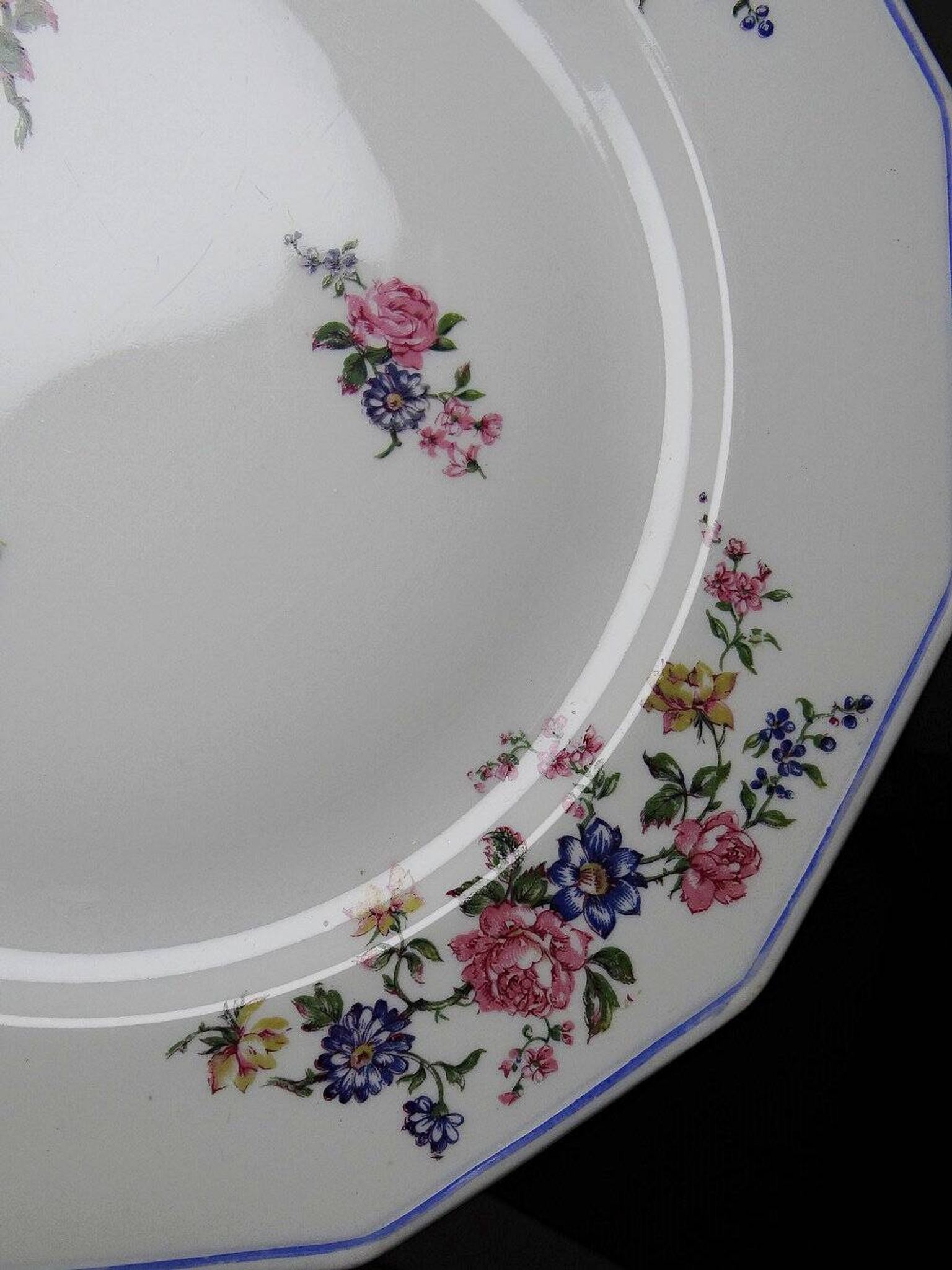 4 flat plates by Bernardaud, Limoges porcelain, floral decoration from the 1920s to 1950s.