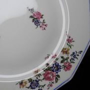 4 flat plates by Bernardaud, Limoges porcelain, floral decoration from the 1920s to 1950s.
