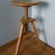 Tripod stool with a screw.