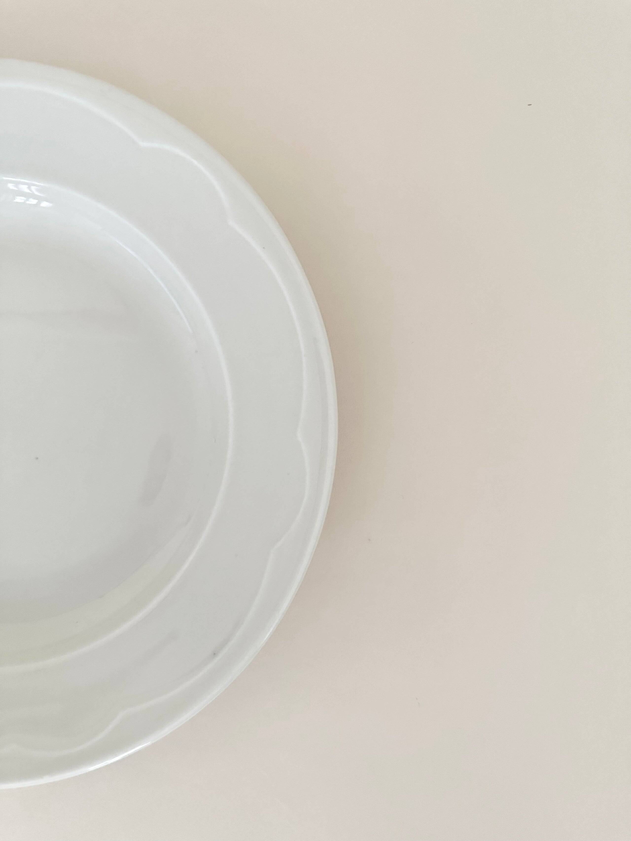 Set of six white porcelain deep plates by Pillivuyt.
