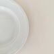 Set of six white porcelain deep plates by Pillivuyt.
