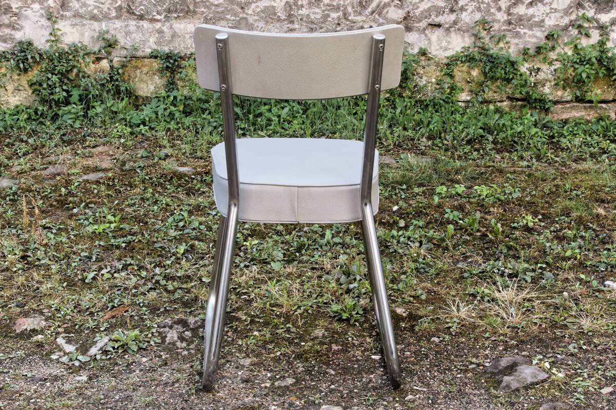 Set of 2 chairs and 1 armchair from the 70s in chrome metal and faux leather.
