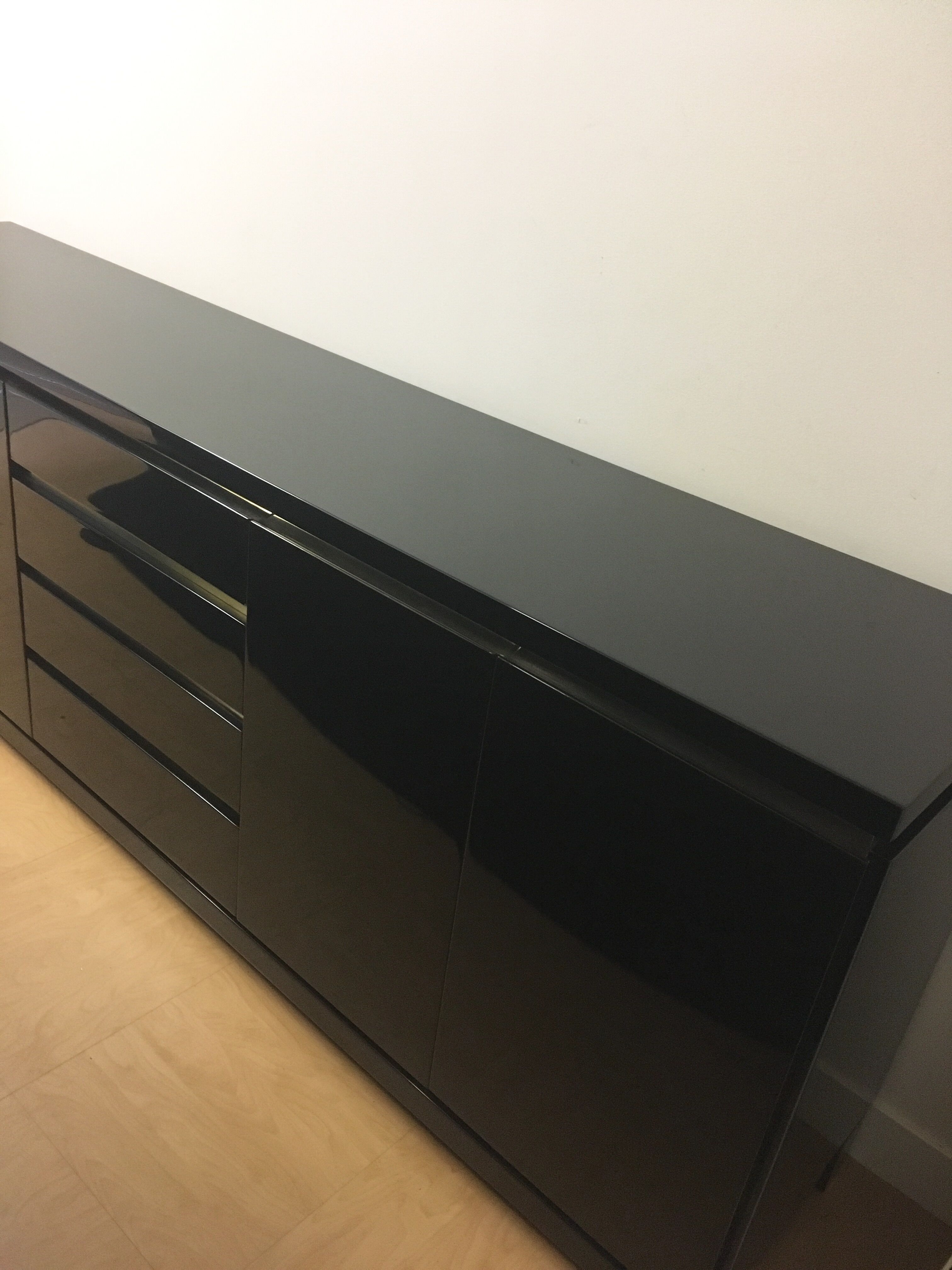 Wide row black lacquer and brass