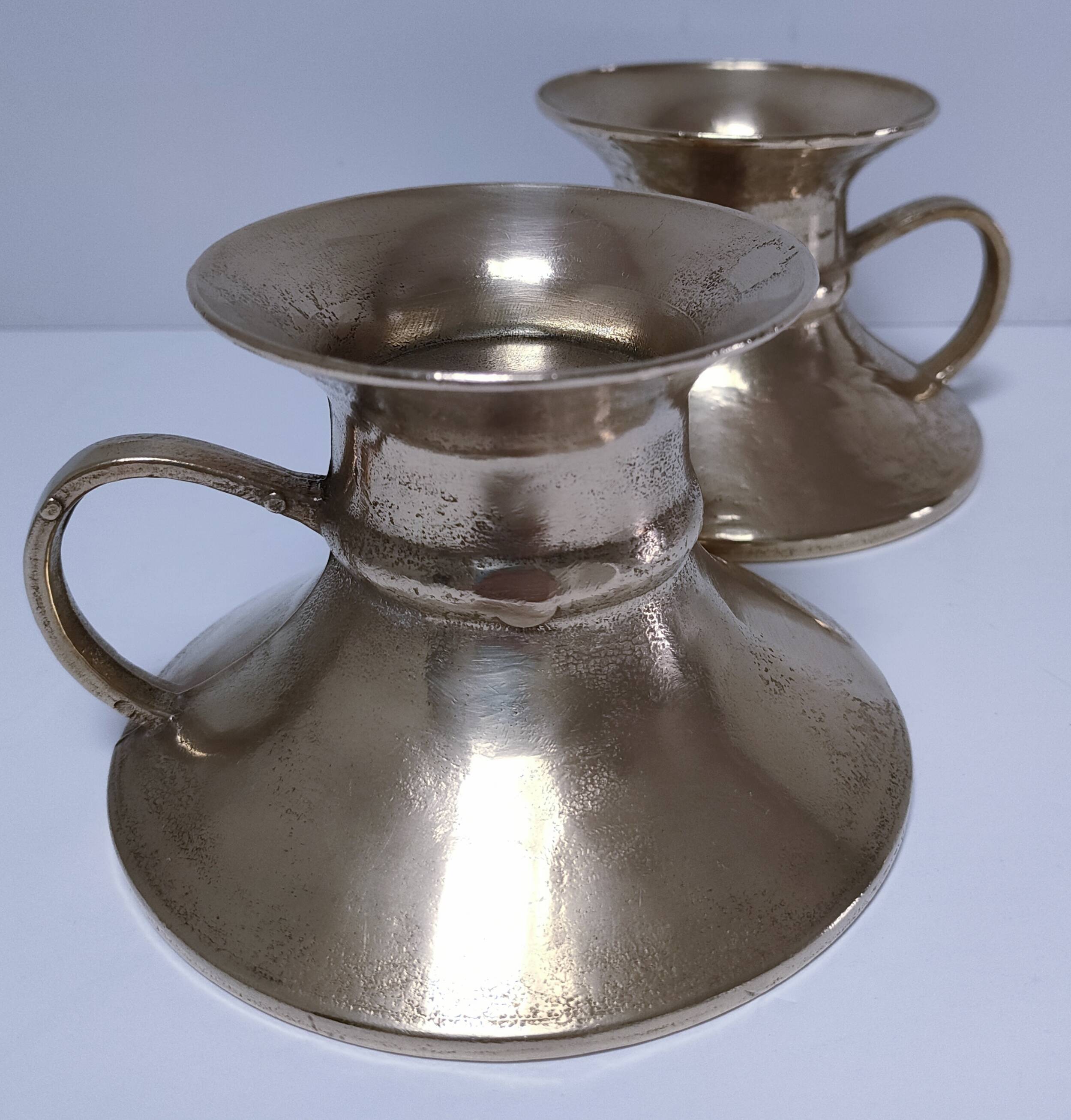 Pair of vintage solid brass hand candlesticks