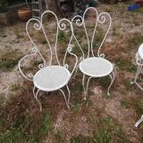 Garden furniture in wrought iron of the 70s. 5 pieces, oval table.