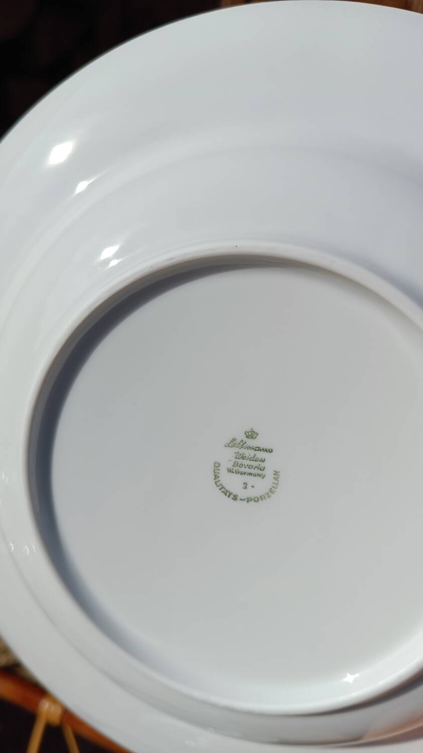 Twelve white porcelain plates