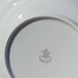 Twelve white porcelain plates