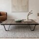 Industrial coffee table made of solid wood and old railway tracks.
