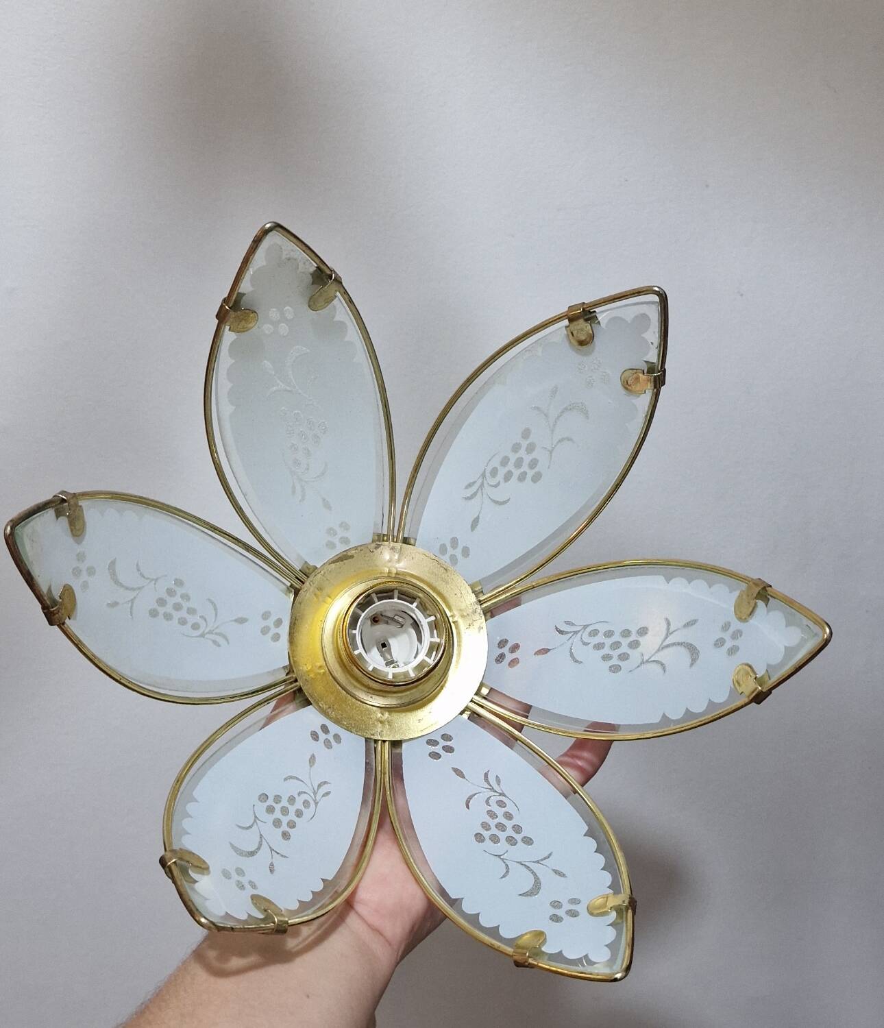 Glass flower rimmed with brass