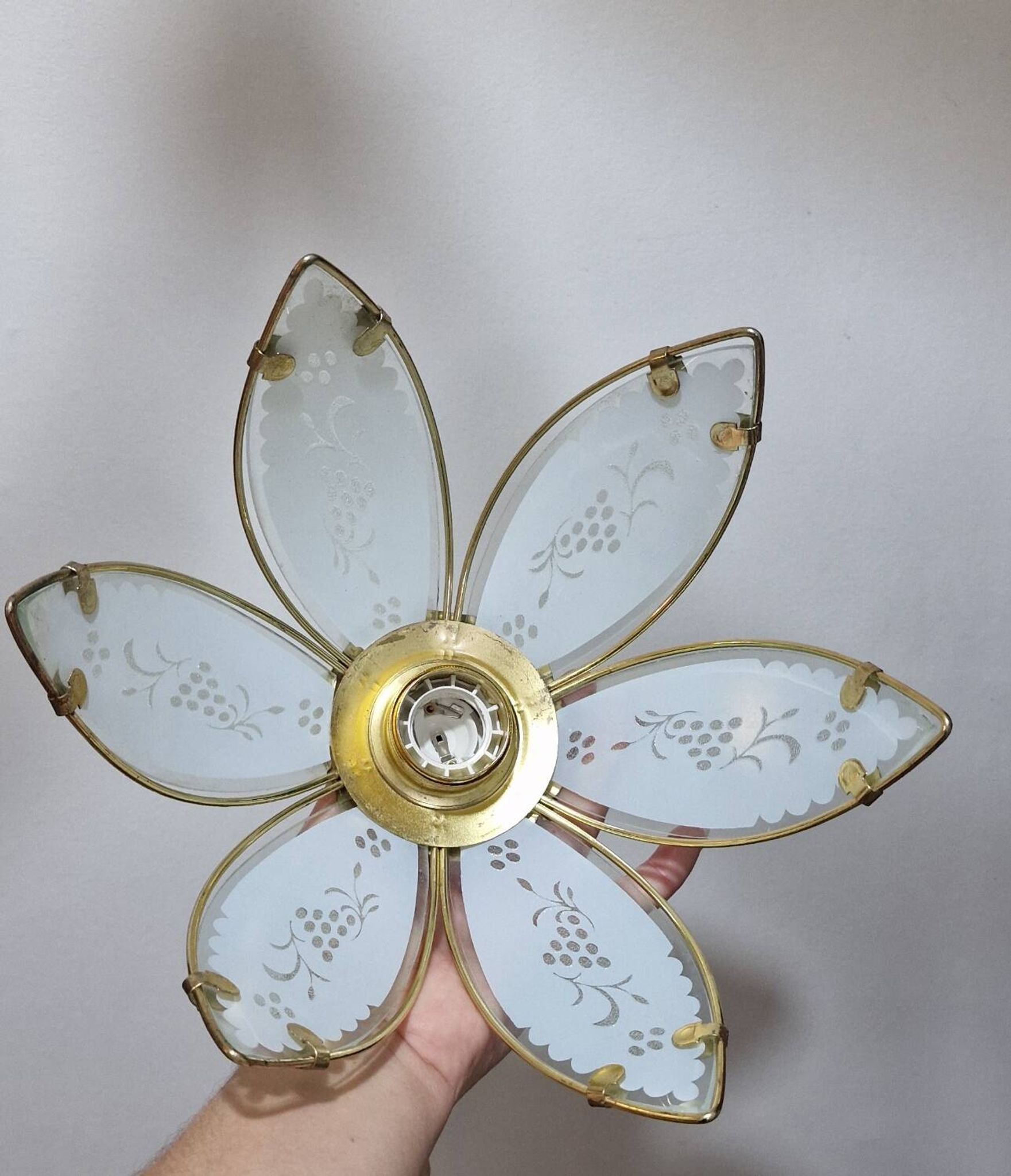 Glass flower rimmed with brass