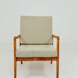Vintage armchair in khaki corduroy, mid-century modern design from the 1960s.