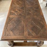 Old dining table with parquet floors