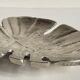Leaf-shaped metal pocket emptier