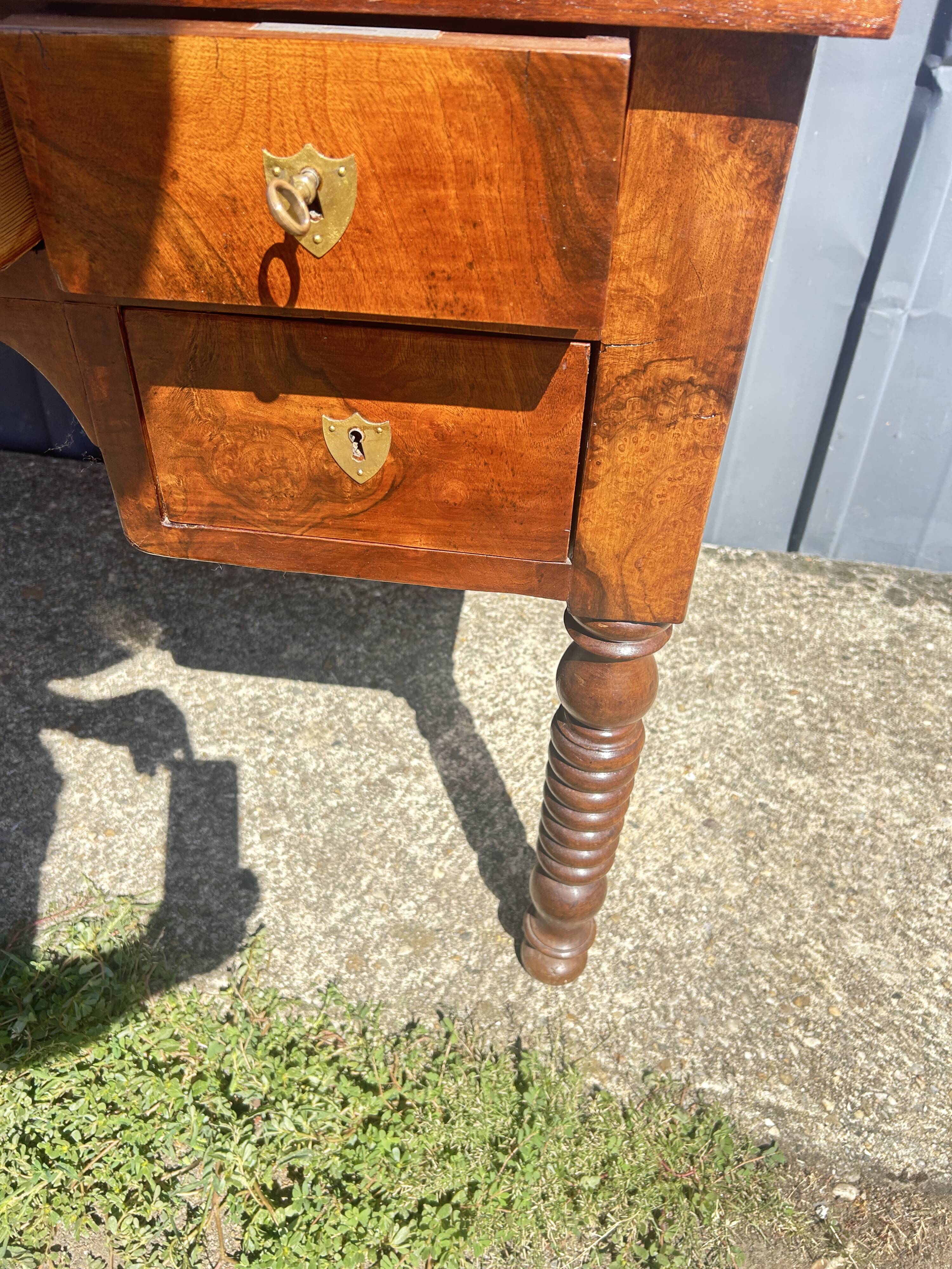 Louis Philippe desk in walnut, with a leather top.